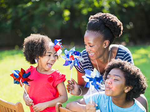 a family plays on the main lawn during presidents day weekend